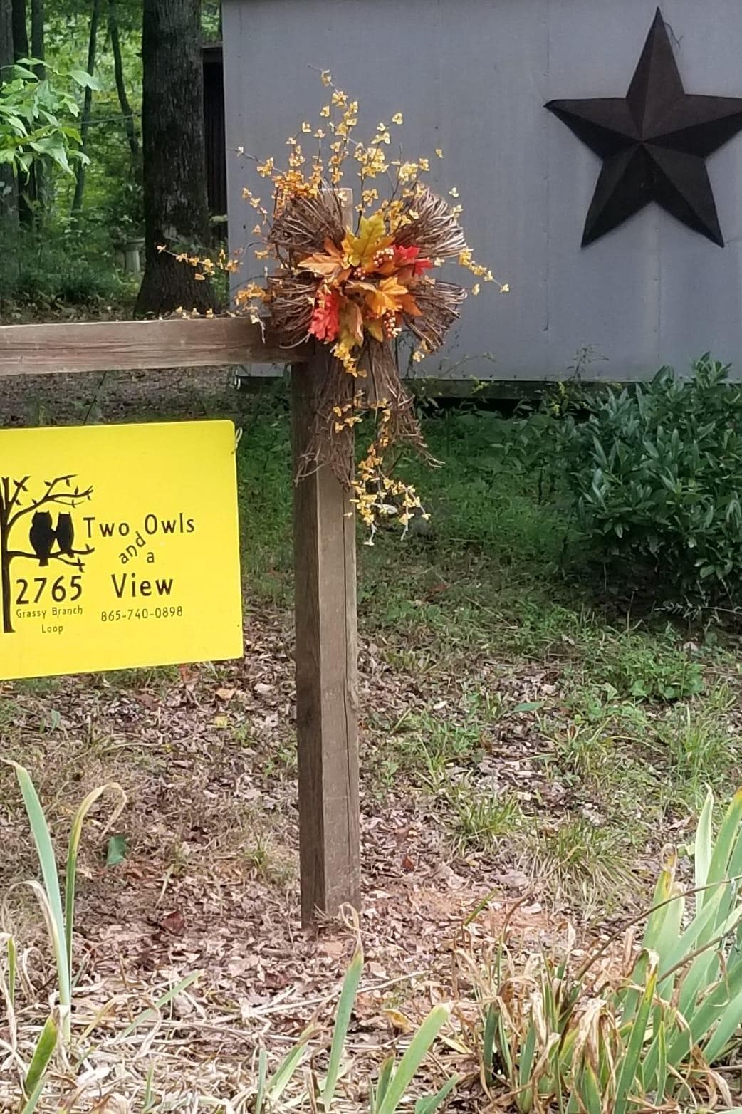 Sign in front of the cabin. 